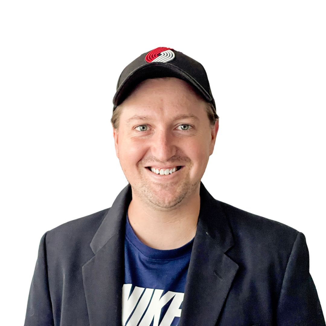 DIY headshot of man in a cap against a white background.